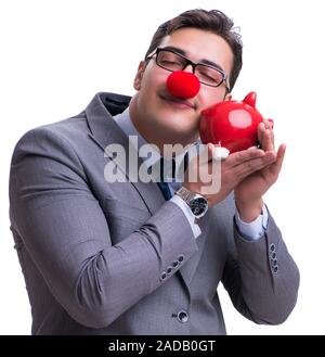 Funny clown imprenditore con un salvadanaio isolato sul retro bianco Foto Stock