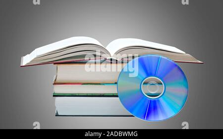 Pila di libri, Libro Aperto e disco DVD come simboli di vecchi e nuovi metodi di memorizzazione delle informazioni Foto Stock