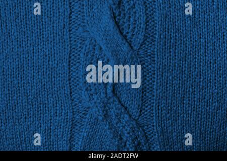 Maglia di lana blu texture. Tessuto di sfondo vista superiore. Classico spiralina a maglia. Foto Stock