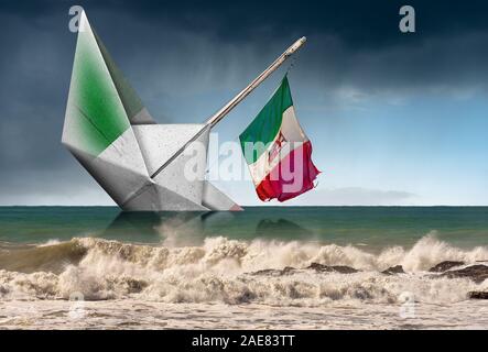 Libro bianco la barca con la bandiera italiana che stanno sprofondando in un mare agitato con le onde e il cielo con la pioggia. Concetto di fragilità Foto Stock