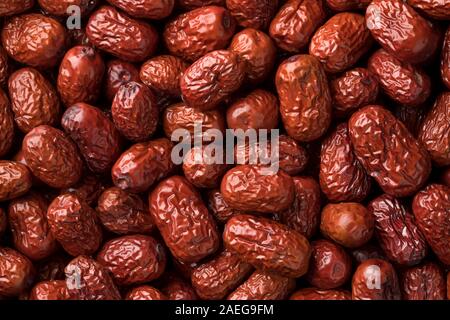 Essiccato intero rosso Cinese date close up full frame Foto Stock