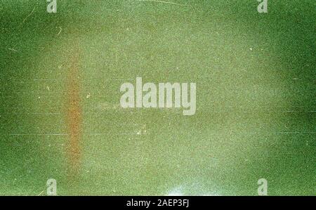 Green filmina sfondo texture con granella pesante e polvere Foto Stock