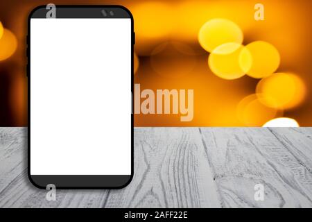 Mobile phone su White background strutturato con spazio di copia e al tramonto Foto Stock