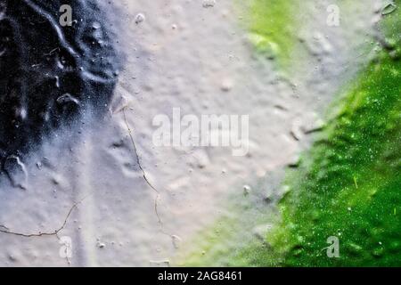 Frammento di graffiti colorati dipinta su un muro di cemento. Texture. Sfondo astratti per la progettazione. Foto Stock