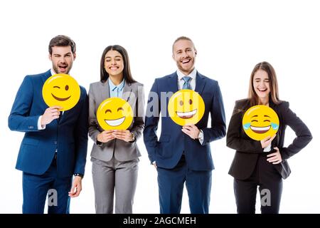 Kiev, Ucraina - 12 agosto 2019: business multiculturale di persone in giacca holding smileys isolato su bianco Foto Stock