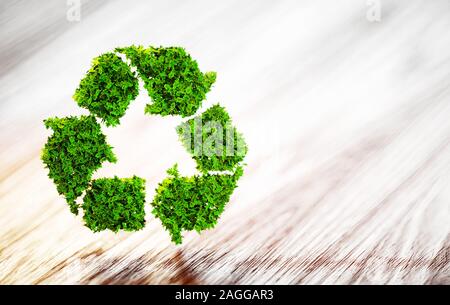Fresca foglia verde simbolo di riciclaggio sulla scrivania in legno con sfondo sfocato. 3D'illustrazione. Foto Stock