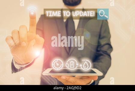 La scrittura della nota che mostra il tempo di aggiornamento. Il concetto di business per questo momento giusto per fare qualcosa di più moderno Foto Stock