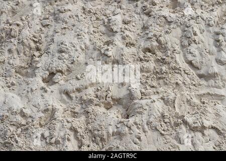 Heap ruvida di sabbia di close-up. Immagine di sfondo. Foto Stock