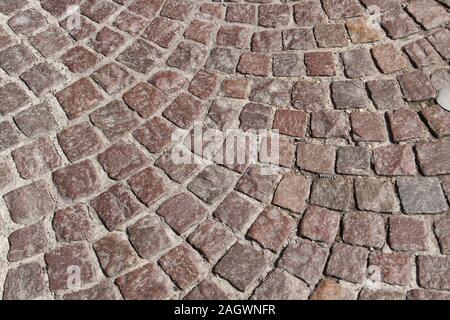 Pietre per pavimentazione sulla strada Foto Stock