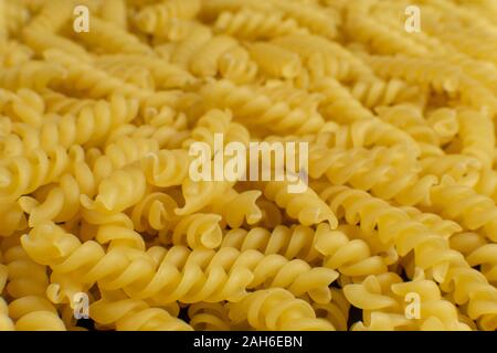 Sfondo formato da una forma a spirale la pasta Foto Stock