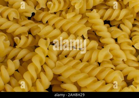 Sfondo formato da una forma a spirale la pasta Foto Stock