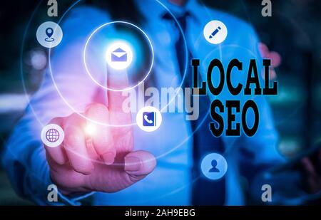 La scrittura della nota mostra Seo locale. Il concetto di business per ottimizzare il vostro sito web di rango migliore per un pubblico di utenti locali Foto Stock