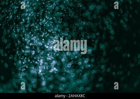 Il fuoco verde forme ember astrazione in sfondo nero Foto Stock