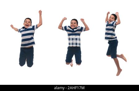 Giovane ragazzo felice Jumping, isolati su sfondo bianco Foto Stock