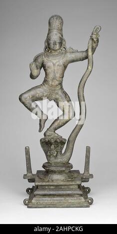 Dio Krishna ballare sulla testa del serpente Kaliya Demon (Kaliyadamana). 1301-1400. Tamil Nadu. Bronzo Foto Stock