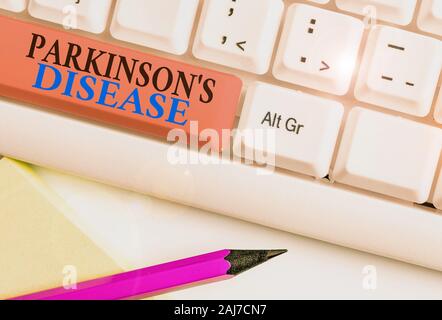 Conceptual la scrittura a mano che mostra il morbo di Parkinson è la malattia. Concetto significato disturbo del sistema nervoso che colpisce il movimento Foto Stock