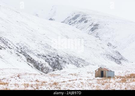 Le colline e le valli di College Valley, Cheviot e Schil nel Northumberland National Park in inverno con neve sulle colline Foto Stock