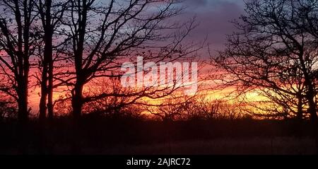 Tramonto su un ranch Foto Stock