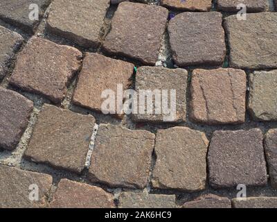 Il porfido rosso pavimento in pietra texture utili come uno sfondo Foto Stock
