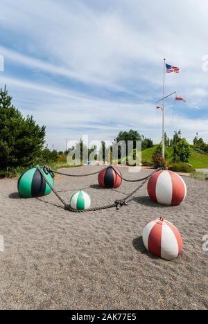 Palla spiaggia arte sulla sabbia in West Seattle, Washington. Foto Stock