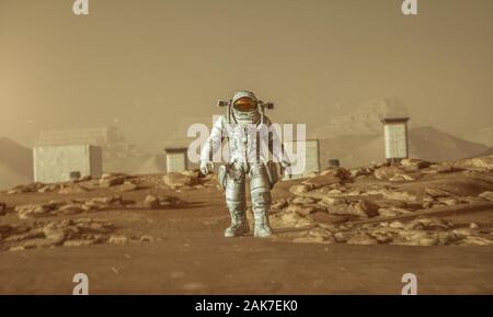Brave astronauta fiduciosamente camminato sulla superficie di Marte Foto Stock