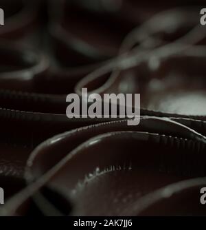 3D rendering di conchiglie di cioccolato con foglie di cioccolato sfocate sullo sfondo. Foto Stock