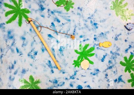 Bambini gioco di pesca con un bastone. Foto Stock