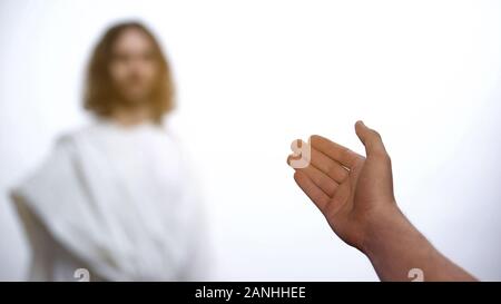 Padre accogliere Gesù Cristo in cielo, figlio di saluto e dando mano Foto Stock