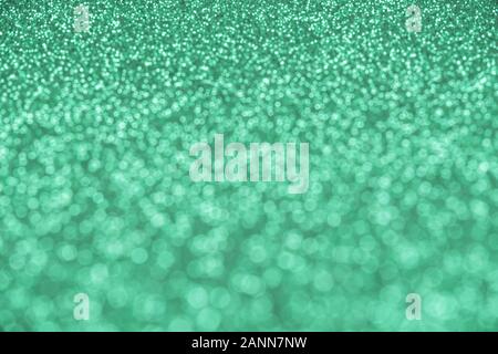 Estratto di menta-colore di sfondo sfocato e paillettes glitter Foto Stock
