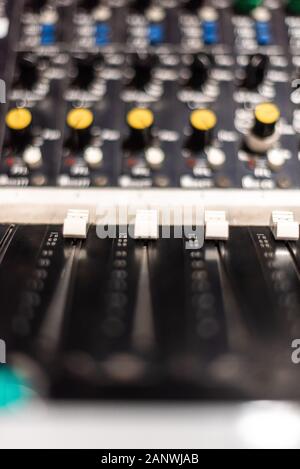 Vintage Looking Detail of a soundboard mixer electronic device manchester uk industry tv radio music video space for text advertising concept Foto Stock