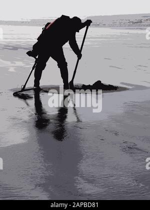 Metal Detecting su una spiaggia di Somerset nel Regno Unito Foto Stock