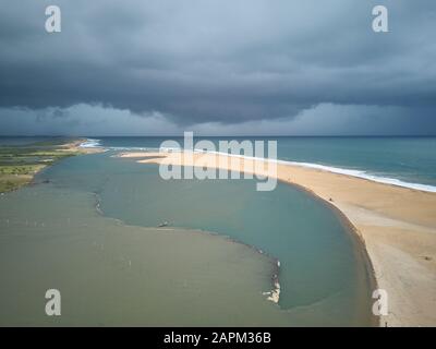 Benin, Grand Popo, veduta aerea delle nuvole tempesta sulla spiaggia sabbiosa del fiume Mono Foto Stock