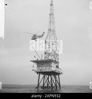 Isola REM occupata, un elicottero cade un agente sulla piattaforma di atterraggio Data: 17 dicembre 1964 Parole Chiave: Agenti, occupazioni, elicotteri Impostazione nome: Isola REM Foto Stock