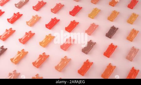 Fagioli di gelatina colorati dell'orso del teddy che compaiono su uno sfondo rosa. Rendering 3D. Foto Stock