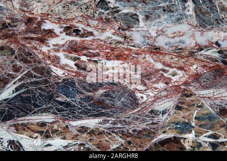 Struttura in marmo scuro naturale, dettagliata struttura in pietra multicolore Foto Stock