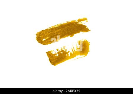 Il doppio DAB della crema è di colore dorato. Swatch di rossetto o ombra dell'occhio. Foto Stock