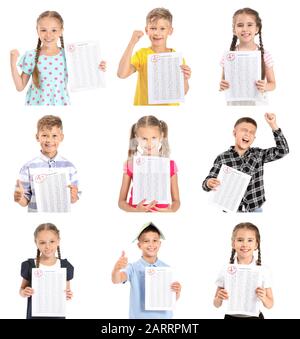 Figli felici con risultati di test scolastico su sfondo bianco Foto Stock