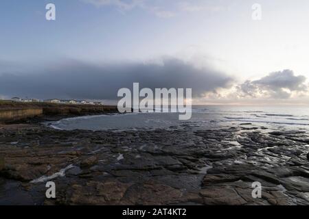 Parco di carovane di Newbiggin-by-the-Sea all'alba, Northumberland. Foto Stock