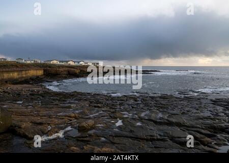 Parco di carovane di Newbiggin-by-the-Sea all'alba, Northumberland. Foto Stock