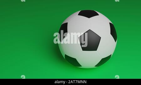 una palla da calcio isolata su sfondo verde, primo piano palla da calcio con spazio copia per lo sfondo sportivo Foto Stock
