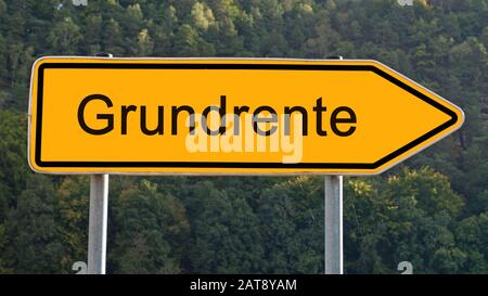 Firma con la parola tedesca Grundrente, pensione Foto Stock