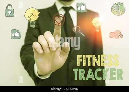 Nota scritta che mostra Fitness Tracker. Concetto aziendale per dispositivi che registra un'attività fisica quotidiana dimostrabile Foto Stock
