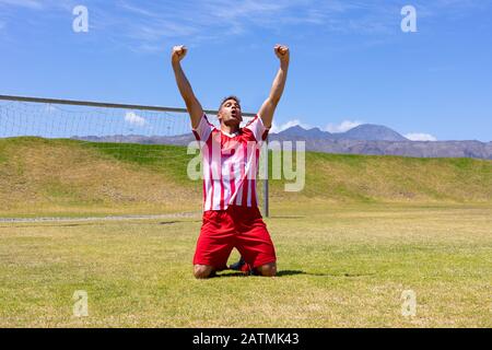 Giocatore di calcio felice Foto Stock