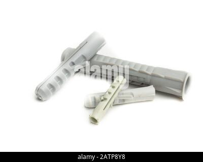 Muro a secco di tasselli a vite su sfondo bianco Foto stock - Alamy