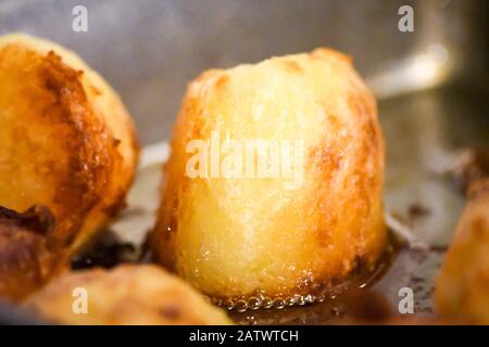 patate arrosto Foto Stock