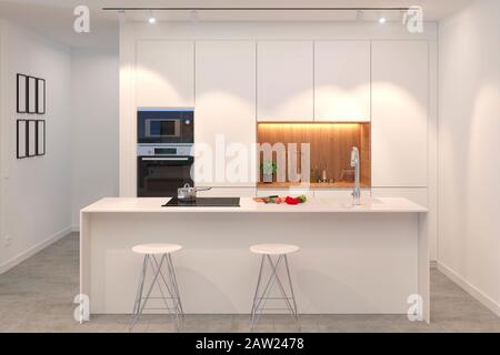 vista frontale del design interno di cucina bianca pulita e moderna con isola Foto Stock