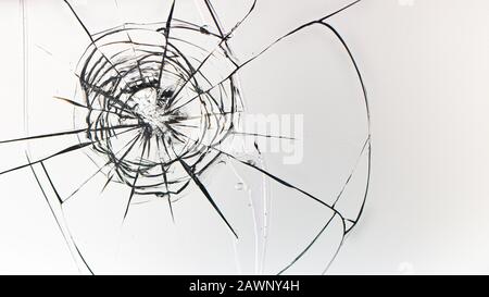 Buchi da sfere in vetro su uno sfondo bianco Foto Stock