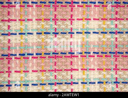 Tessuto multicolore astratto texture, primo piano di moda sfondo. Tessuto tweet multicolore con plaid. Foto Stock