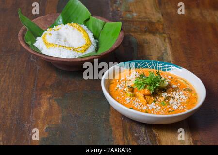 Bengalese Doi Maach un curry di pesce denso e speziato servito con riso Foto Stock