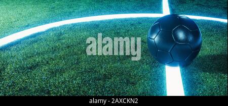 Campo da calcio neon con palla su linee incandescenti su un campo verde erboso di notte in un panorama banner con spazio copia per lo sport o il tema del calcio Foto Stock
